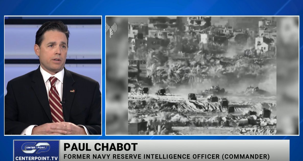 Paul Chabot being interviewed on television as a former Navy Reserve intelligence officer